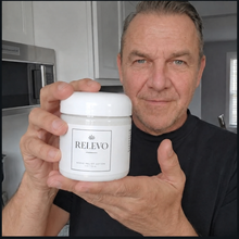Customer holding the RELEVO Nerve Relief Lotion jar